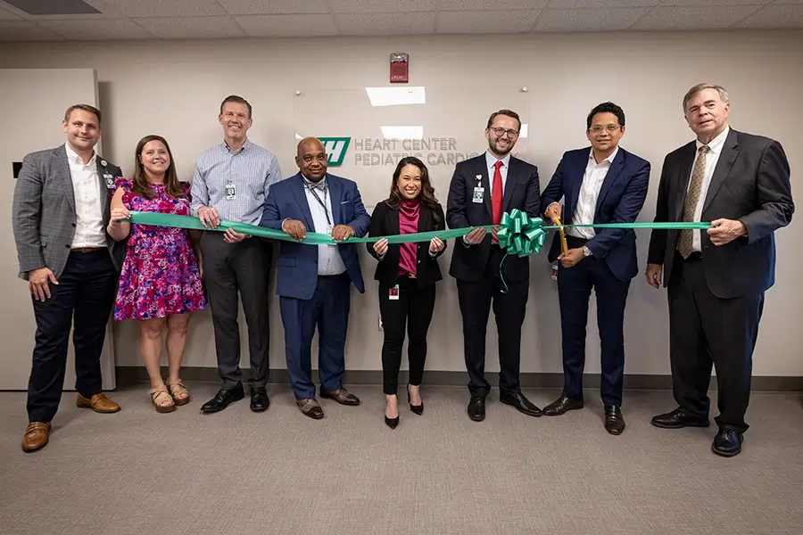 Huntsville Hospital leadership, pediatric cardiologists and Huntsville's Mayor Battle cut the ribbon on the new Heart Center Pediatric Cardiology office.